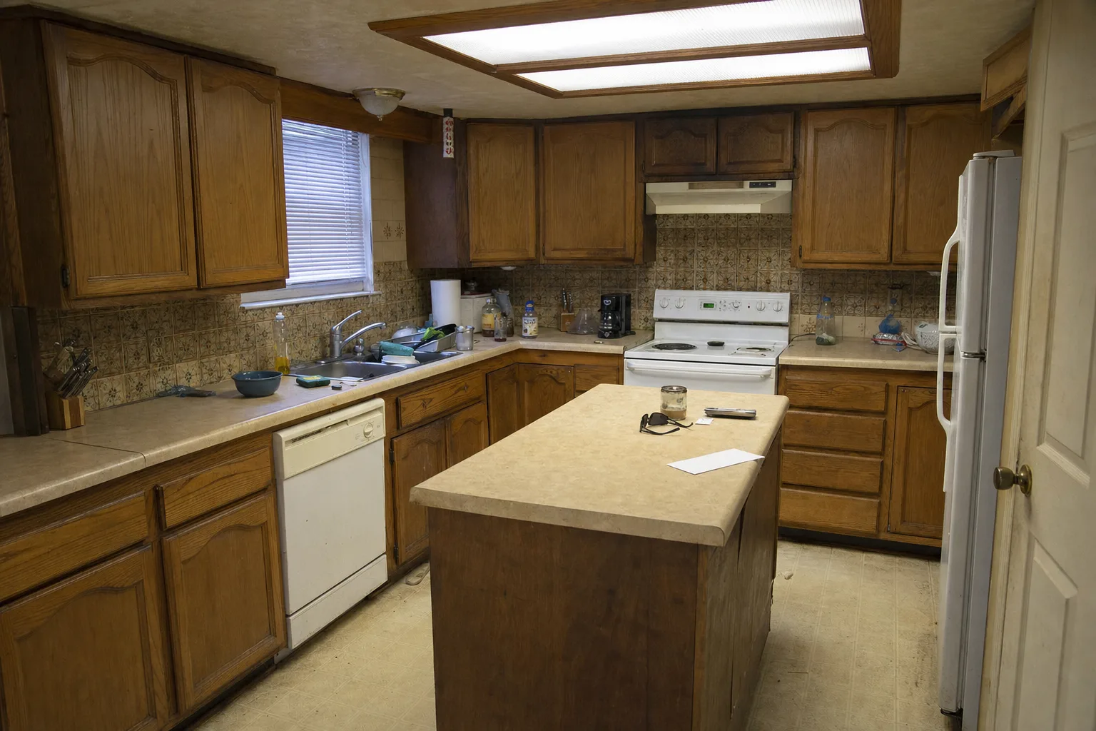 Gladwyne kitchen before renovation with dark, dated cabinetry